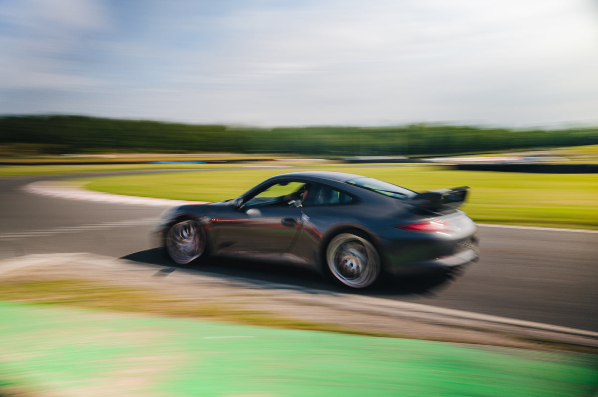 A dark gray Porsche 911 GT2 sports car